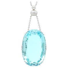 A stunning, fine and impressive, large 48.34 carat aquamarine and 0.70cttw diamond, platinum and 18 karat yellow gold necklace; part of our diverse aquamarine jewelry collections. This magnificent, fine and impressive pendant has been crafted in platinum and 18k yellow gold. The drop style pendant is ornamented with a stunning and large vintage (circa 1940) claw set 48.34ct cushion cut aquamarine; the nature of the aquamarine cut allows the piece to sit flush in situ, this is a fine feature of the piece. The feature platinum setting suspends via two chains from a yellow gold and platinum set vertical linear antique (circa 1900) diamond arrangement. This array is comprised of an impressive millegrain decorated collet set 0.53ct Old European oval cut diamond, surmounted with a collet set 0.1 Platinum Chain, 18k Gold Necklace, Aquamarine Pendant, Yellow Gold Necklace, Aquamarine Jewelry, Diamond Settings, Oval Cut Diamond, Gold Platinum, Aquamarine