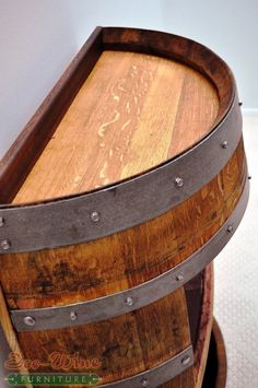 a wooden barrel sitting on top of a table