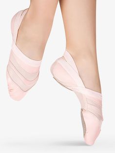 the feet of a ballerina in pink ballet shoes