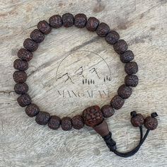 📿Natural Aged Dark Black Rudraksha Beads Adjustable Bracelet The Rudraksha beads are sanded in a tumbler for comfort before being naturally stained and oiled to achieve their beautiful dark color and aged appearance. The natural and sustainable seed beads have amazing texture and visual appeal. Bead Size - 8.0 - 9.0MM 🪔Length - 7.5 Inches (Adjustable to 1 Inch) 📿 Rudraksha Beads 📿 ✨🪵Peace ✨ Concentration ✨ Protection ✨Spiritual Evolution ✨ Mental Clarity Rudraksha beads are known for their healing properties and protective powers. By meditating with a rudraksha mala, it is believed to increase the ability to concentrate, giving clarity and peace of mind. Their size and texture make them great for promoting concentration during meditation. These beads are said to be very powerful and w Rudraksha Mala, Rudraksha Beads, Silk Gifts, Yoga Bracelet, Yoga Gifts, Healing Bracelets, Bead Leather, Shiva, Adjustable Bracelet