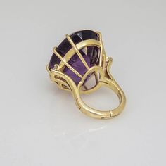 Large Oval Facetted Amethyst approximately 35c prong set with 2 - .25c each diamonds on either side mounted in a 14k yellow gold mounting.  US size 4 - It can be made larger.    .5 depth is from top of stone to top of finger.  The ring measures 1" wide by 1.04" tall by .5" deep. Antique Amethyst Jewelry, Amethyst Jewelry Ring, Antique Amethyst Ring, Amethyst Birthstone Ring, Large Stone Rings, Jewelry Knowledge, Silver Pooja Items, Rough Diamond Ring, Amethyst Birthstone