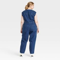 Add this Tailored Denim Jumpsuit from Universal Thread™ to your everyday wardrobe for putting together a variety of chic outfits. Made of recycled cotton, this denim jumpsuit is fashioned in a crewneck style with a zipper for easy on and off. This sleeveless jumpsuit boasts two front pockets and two back pockets to keep your essentials close at hand and also features belt hoops for versatile wear. Universal Thread™: Found exclusively at Target. Fitted Cotton Utility Denim Jumpsuit, Fitted Cotton Denim Utility Jumpsuit, Medium Wash Relaxed Fit Cotton Denim Jumpsuit, Medium Wash Cotton Jumpsuit For Work, Workwear Medium Wash Cotton Jumpsuit, Relaxed Fit Dark Wash Denim Jumpsuit, Dark Wash Cotton Jumpsuit For Work, Medium Wash Cotton Jumpsuits And Rompers For Work, Cotton Jumpsuit For Work In Medium Wash