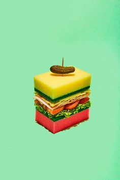 a sandwich is floating in the air with a cookie on it's top and bottom