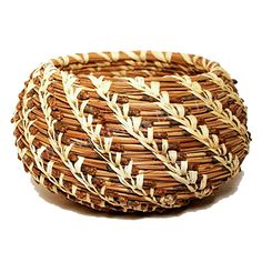 a close up of a woven basket on a table