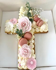 a cross made out of cookies and flowers