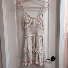 Just A Simple Beachy Dress. Lots Of Cute Ruffles And A Ruched Waist. Adjustable Straps. I Have It At 34.5" In The Photos But It Can Go A Little Longer. The Waist Area With The Ruching Is 13" Across Unstretched But Can Stretch 10" Longer. 100% Rayon. Size M But Can Probably Fit Small Too. Casual Mini Dress With Lace Trim, White Bohemian Tiered Mini Dress, Bohemian White Tiered Sundress, White Tiered Bohemian Mini Dress, Fitted White Boho Casual Dress, White Fitted Boho Dress Casual Style, White Fitted Casual Boho Dress, Casual Fitted White Boho Dress, Beachy Dresses