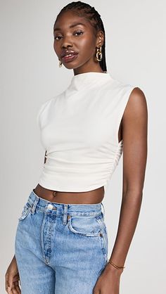 Reformation Lindy Knit Top | SHOPBOP Trendy Sleeveless Stretch Crop Top, Trendy Stretch Sleeveless Crop Top, Trendy Sleeveless Crop Top For Layering, Fitted Cropped Mock Neck Top For Spring, Chic High Neck Cotton Tops, Cropped Tank Top For Layering, Sleeveless Crop Top For Layering, Chic Fitted Crop Top For Layering, Spring Chic Turtleneck Crop Top