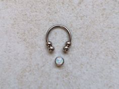 "Silver Septum Clicker or Daith Earring Ring with White Opal 📯 SPECIAL OFFER: If you buy this White Opal septum ring, together with either Blue or Purple, you will get 3rd one as a gift! 🎁 Blue: https://www.etsy.com/listing/793235153/silver-septum-clicker-daith-earring-ring Purple: https://www.etsy.com/listing/794876351/silver-septum-clicker-ring-daith-earring HOW YOU CAN WEAR IT? ❖ daith captive bead ring ❖ septum captive bead ring ❖ septum horseshoe ❖ septum retainer DIMENSIONS ❖ 16 gauge (1 Gift Metal Septum Ring Internally Threaded, Nickel Free Round Septum Ring As Gift, Nickel-free Round Septum Ring As Gift, Nickel-free Round Septum Ring Gift, Spiritual Round Septum Ring Gift, Spiritual Style Septum Ring Gift, Spiritual Gift Septum Ring, Nickel Free Metal Septum Ring As Gift, Nickel-free Metal Septum Ring As Gift