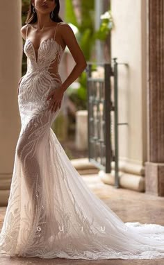 a woman in a wedding dress posing for the camera