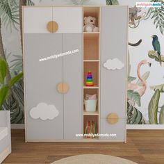 a child's room with tropical wallpaper and toys in the cupboards for storage