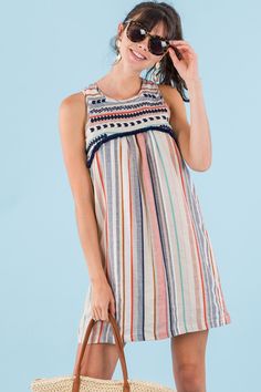 Boho Stripes Sundress Cotton Fringe Dress For Vacation, Cotton Summer Dress With Vertical Stripes, Bohemian Striped Sleeveless Dress, Bohemian Sleeveless Striped Dress, Bohemian Striped Cotton Dress, Striped Cotton Bohemian Dress, Striped Cotton Beach Dress, Spring Cotton Dress With Striped Hem, Casual Cotton Dresses With Tassels