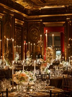 the tables are set with candles and centerpieces for an elegant wedding reception at the state dining room