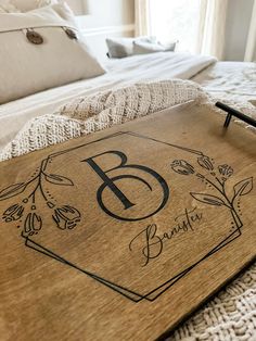 a wooden tray with the letter b on it