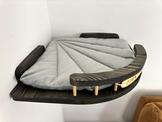 a bed that is sitting on top of a shelf