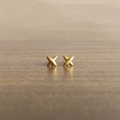 With inspiration drawn from celestial map markings, these studs beautifully illuminate the lobe. 18k yellow gold Studs measure 7mm x 7mm (1/4" x 1/4")Each earring weighs 0.6g Everyday Yellow Gold Earrings With Star Charm, Tiny Star-shaped 14k Gold Jewelry, Star-shaped 14k Gold-filled Earrings, Everyday Star-shaped Yellow Gold Earrings, 14k Gold-filled Star Earrings, Cross Stud Earrings, Celestial Map, Cross Earrings Studs, Star Cross