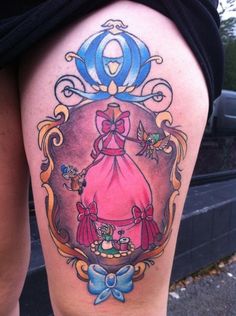 a woman's thigh with an image of a princess in a frame on it