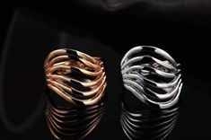 Six individual lines create a rolling visual effect. Streamlined and in perfect harmony they trace each other's pattern in an elegant formation. Not overly large but definitely makes a statement. It is a fun and unusual ring, and comfortable to wear. Available in two complimentary colors: 18k Rose Gold or White Gold Plating. Triple plated for quality and durability. Materials: 18k Rose Gold or White Gold Plating over brass Size: 2 cm (approximately 3/4 of an inch) Comes gift boxed (Original Pric Line Jewelry, Normal Body Temperature, Gold For Women, Unusual Rings, Complimentary Colors, Sell Gold, Sale Event, White Ring, White Gold Rings