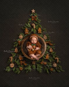 a baby is sitting in a wooden bowl surrounded by green leaves and ornaments on a black background