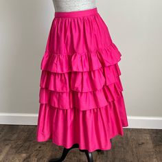 Howard Wolf Dallas New York Vintage Hot Pink Tiered Ruffle Midi Skirt With Pockets Vintage Size 8 - Please Note Vintage Runs Smaller. See Measurements. There Is No Stretch. Will Accommodate Up To A 27" Waist As Shown In Photos. Approximate Length 28" (See Photo) Hot Pink, Barbie Pink Pockets Layered Ruffle, Tiered Lined Zip With Button Closure Nwt/Unworn. Original Tags Intact And Originally Attached (Circa Late 70s, Early 80s) Smoke Free Same/Next Day Shipping Vintage Cotton Square Dance Skirt C Retro Ruffled Bottoms For Spring, Retro Tiered Ruffle Skirt, Vintage Ruffled Bottoms For Spring, Spring Vintage Ruffled Bottoms, Hot Pink Barbie, Ruffle Midi Skirt, 1980s Women, Midi Skirt With Pockets, New York Vintage