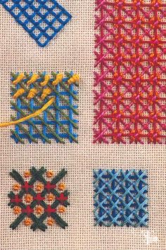 four different colored crochet designs on a white cloth with yellow thread and scissors