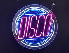 a neon sign with the word disco on it