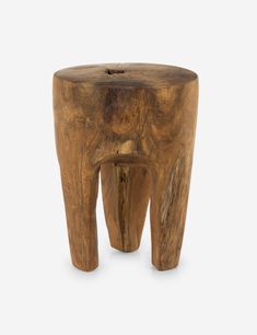 a small wooden stool made out of wood