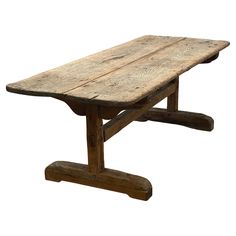 an old wooden table with two legs and a long slab on the top, isolated against a white background