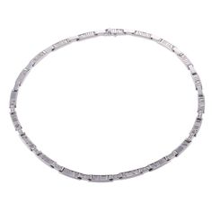 18k white gold link necklace by Tiffany Atlas collection, set with approx. 0.90ctw VS/G diamonds. DESIGNER: Tiffany & Co MATERIAL: 18k Gold GEMSTONES: Diamond DIMENSIONS: Necklace is 15.5" long and 5.5mm wide MARKED/TESTED: Tiffany & Co, 750, 1995, Italy WEIGHT: 67.6 grams CONDITION: Previously Owned, Excellent Condition. Modern Diamond Chain Necklace In White Gold, Modern White Gold Diamond Chain Necklace, Modern White Gold Diamond Necklace With Baguette Diamonds, White Gold Diamond Necklace With Baguette Diamonds In Platinum, Classic Silver Diamond Necklace With Baguette Diamonds, Luxury Diamond Necklace With Channel Set, Silver Baguette Cut Platinum Diamond Necklace, Silver Platinum Baguette Cut Diamond Necklace, Modern Silver Diamond Necklace With Vvs Clarity