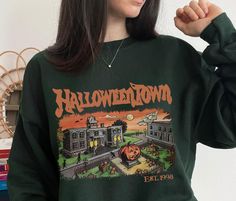 Retro Halloween Town University Est 1998 Sweatshirt 🤍How to Order🤍 - Please Check All the Photos and Size Chart - Select your Color and Size - Click ADD TO CART - Click Proceed to Check Out 🤍Size🤍 - Take a look at the photos to see a specific sizing chart for this sweatshirt style - Lay your favorite shirt at home flat and measure armpit to compare to the size chart in the photos - Please note that these shirts are unisex size meaning they are not women's fitted shirts. - If you're going for Halloween Town University, Fall Crewneck Sweatshirt, Halloweentown University, Spooky Aesthetic, Fall Crewneck, Aesthetic Sweaters, Fitted Shirts, Sweatshirt Style, Style Sweatshirt