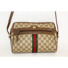 Vintage Gucci Monogram Shoulder Crossbody Bag Brown Canvas. Authentic, pre-loved vintage Gucci web GG Supreme coated canvas shoulder bag. This chic and rare Gucci web bag is a must-have for Gucci lovers.  Authentic vintage marked as Gucci Accessory collection with serial number. Classic Vintage Gucci purse. This is a classic crossbody bag with signature red and green canvas striping.  Vintage Brown & Beige GG Supreme Ophidia Bag Coated canvas shoulder bag in beige featuring logo pattern in brown Retro Monogram Canvas Shoulder Bag For Travel, Retro Monogram Canvas Shoulder Bag For Everyday, Retro Gucci Rectangular Shoulder Bag, Retro Monogram Canvas Rectangular Shoulder Bag, Vintage Monogram Canvas Satchel Shoulder Bag, Retro Rectangular Monogram Canvas Shoulder Bag, Retro Monogram Canvas Shoulder Bag, Vintage Gucci Shoulder Bag For Everyday, Vintage Shoulder Bag In Monogram Canvas