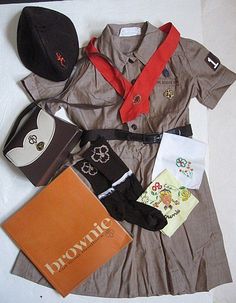 an assortment of clothing and accessories laid out on a white surface with the word fashion written below it