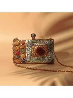 Embellished Mother of Pearl Clutch  Size:-20 cm x 16 cm x 4 cm (L x W x H) Material: Cotton, Silk, Metal, Pearls  Weight: 6-8 Oz Approx Qty: 1pc. We deliver worldwide We usually ship within 10 days after receiving clear payment, We accept PayPal and deliver via DHL, DTDC, USPS USPS Standard Shipping Service is FREE. It takes 15 to 22 days to delivered. This can be upgraded with Express service via USPS Premium Shipping which takes 10 to 15 days  or DHL Urgent shipping takes 5 to 7 business days Express Shipping option you can choose after click on "Add to Cart Button" Kindly contact us for any queries, we are here to help you please send your phone number for international shipping, courier service needs your phone number for shipping. Disclaimer - Actual colors may vary slightly due to co Gold Bohemian Clutch For Formal Events, Bohemian Gold Clutch For Formal Occasions, Designer Multicolor Clutch For Party, Bohemian Multicolor Clutch For Evening, Formal Multicolor Handmade Clutch, Multicolor Hand Embellished Clutch For Party, Vintage Multicolor Clutch For Formal Occasions, Bohemian Multicolor Evening Clutch, Gold Pearl Clutch With Pearl Embroidery