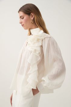 Aura Frilled Tie Blouse | Ivory | Aje – Aje ROW Formal V-neck Blouse With Ruffles, Elegant Summer Blouse With Set-in Sleeves, Elegant V-neck Ruffled Blouse, Elegant Ruffled V-neck Blouse, Elegant V-neck Ruffle Blouse, Chic Formal Blouse With Ruffle Sleeves, Summer Ruffle Top With Bishop Sleeves, Chic Formal Top With Set-in Sleeves, Chic Formal Tops With Ruffle Sleeves