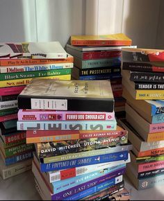 a pile of books sitting on top of a table