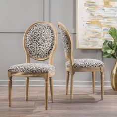 a pair of dining chairs for sale on the internet