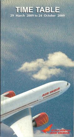 an air india plane flying in the sky with clouds behind it and time table written below