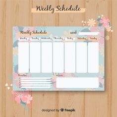 the weekly schedule is displayed on a wooden surface with flowers and leaves around it, as well as an empty space for text