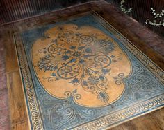 an old rug on the floor in a room