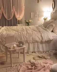 a bed room with a neatly made bed and chandelier