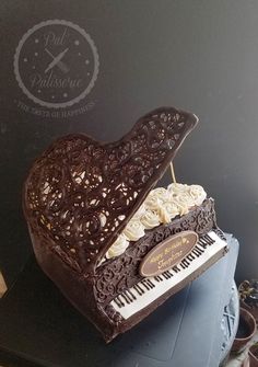 a cake shaped like a piano on top of a table