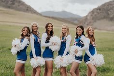 a group of cheerleaders posing for a photo