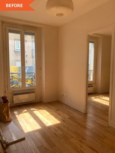 an empty room with hard wood flooring and large windows in the corner, before and after remodel