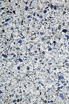 an image of blue and white speckles on the ground with no one in it