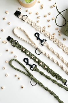 four different types of crochet leashes on a table with beads and yarn