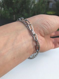 This is a double strand bracelet that features a paperclip chain and a dainty curb chain. This is a handmade piece. Stainless steel is a great material for jewelry - it's tarnish and rust resistant, it's hypoallergenic (good for sensitive skin/ won't discolor your skin), it is extremely strong and can last a lifetime with proper care. To clean this piece just use some soap/water and a thorough dry.  Specifications: - - - - - Color: silver Material: 100% 304 Stainless Steel Closure: lobster claw Dainty Choker Necklace, Curb Chain Bracelet, Bracelet Elegant, Dainty Choker, Woven Chain, Mesh Bracelet, Crystal Beads Bracelet, Strand Bracelet, Chunky Necklace