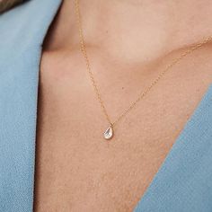 The Delicate CZ Drop Necklace features a high-quality cubic zirconia pendant in a teardrop format on a delicate 14K gold-filled chain. This tiny diamond pendant necklace is perfect for a bridesmaid necklace gift or for that special occasion. PRODUCT DETAILS: The stone is 6mm. Zirconia Stone in a 14k goldfilled setting MATERIALS: 14K Gold Filled 14K Gold Filled jewelry is not the same as gold-plated jewelry. It contains 5% of solid gold and is done by a process of heat bonding. The layer of gold Delicate Teardrop Pendant Drop Necklace For Anniversary, Delicate Diamond Drop Necklace Gift, Delicate Teardrop Drop Necklace For Anniversary, Delicate Teardrop Necklace For Anniversary, Dainty Cubic Zirconia Drop Necklace For Gift, Gold Solitaire Drop Necklace For Wedding, Dainty Pear-shaped Drop Necklace For Anniversary, Anniversary Teardrop Drop Necklace With Delicate Chain, Delicate Solitaire Teardrop Pendant Necklace As Gift