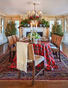 a dining room table set for christmas dinner