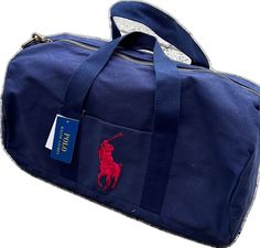 Blue Travel Bag With Top Carry Handle For On-the-go, Casual Blue Duffle Bag For School, Casual Blue Satchel Travel Bag, Blue Casual Satchel Travel Bag, Blue Satchel Duffle Bag For On-the-go, Casual Blue Rectangular Travel Bag, Casual Blue Tote Duffle Bag, Blue Rectangular School Travel Bag, Blue Casual Tote Duffle Bag