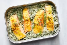 fish and rice in a pan on a table