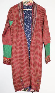 Vintage original kaftan from Turkmen people, Central Asia, with nice elegant rim and neck embroidery. On the sides the coat has an elaborate embroidered Oriental pattern. The ceremonial coat is worn open and has therefore no buttons, hooks, nor belt. The inside is lined with blue cotton fabric. In very good condition, no signs of heavy wear or repairs.  Size: comparable to European size L shoulder width: 50 cm chest: 52 cm sleeve length: 60 cm cuff width: 15 cm total length: 105 cm CA177 If sold Festive Long Sleeve Kaftan With Woven Motifs, Traditional Tunic Kimono For Eid, Traditional Long Patchwork Kimono, Traditional Red Winter Kimono, Festival Long Sleeve Kaftan With Woven Motifs, Multicolor Long Sleeve Kaftan With Embroidered Border, Traditional Winter Kimono, Traditional Kimono With Patterns For Festival, Folk Style Kaftan With Woven Motifs For Eid